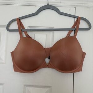 Used tan Victoria Secret bra size 38D. Minor pulling.